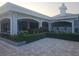 Exterior view of the clubhouse with covered seating and manicured landscaping enhancing community charm at 2333 Feather Sound Dr # A401, Clearwater, FL 33762