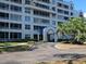 Beautiful multi-story condo building featuring private screened patios and a covered entrance at 2333 Feather Sound Dr # A401, Clearwater, FL 33762