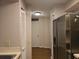 Hallway features a stainless steel refrigerator and neutral walls at 2333 Feather Sound Dr # A401, Clearwater, FL 33762