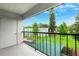 Balcony view overlooking the landscaped backyard and apartment buildings at 2834 Somerset Park Dr, Tampa, FL 33613