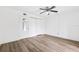 Bright bedroom featuring wood floors and a ceiling fan for added comfort at 2834 Somerset Park Dr, Tampa, FL 33613