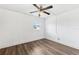 Bedroom featuring wood floors and a ceiling fan for added comfort at 2834 Somerset Park Dr, Tampa, FL 33613