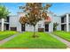 Charming townhouse complex with well-maintained landscaping and inviting curb appeal under a bright blue sky at 2834 Somerset Park Dr, Tampa, FL 33613