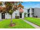 Charming condo exterior featuring well-maintained landscaping and inviting entryway at 2834 Somerset Park Dr, Tampa, FL 33613