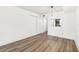 Bright, open living space with modern flooring and a view into the kitchen at 2834 Somerset Park Dr, Tampa, FL 33613