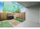 Cozy patio featuring a grill and privacy fence, perfect for outdoor relaxation at 2834 Somerset Park Dr, Tampa, FL 33613