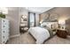 Inviting bedroom boasts soft carpet, elegant decor, and a serene ambiance, perfect for relaxation at 29472 Velletri Ln, Wesley Chapel, FL 33543