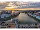 Breathtaking aerial view of the community, showcasing the waterfront location and boat docks at sunset at 3018 59Th S St # 209, Gulfport, FL 33707