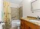 Well-maintained bathroom featuring a shower and bathtub combination and a vanity with granite countertops at 3018 59Th S St # 209, Gulfport, FL 33707
