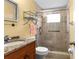 Bathroom with a glass shower, granite vanity, and modern fixtures at 3018 59Th S St # 209, Gulfport, FL 33707