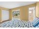 Bedroom featuring a comfortable bed, closet space, and en-suite bathroom for convenient living at 3018 59Th S St # 209, Gulfport, FL 33707