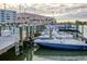 Boat dock featuring multiple boat slips with well-maintained boats and calm water reflections at 3018 59Th S St # 209, Gulfport, FL 33707
