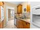 Well-appointed kitchen with granite countertops, wood cabinets, tile backsplash, and modern appliances at 3018 59Th S St # 209, Gulfport, FL 33707