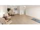 Spacious living room with tile flooring, dining area, and ample natural light, ready for personalization at 3018 59Th S St # 209, Gulfport, FL 33707