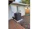View of the side yard showing the HVAC unit and access to the back patio at 3118 Adrian Ave, Largo, FL 33774