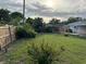 The backyard features a full wooden fence that runs along the perimeter at 3118 Adrian Ave, Largo, FL 33774