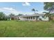 Lush backyard with a spacious deck and plenty of room for outdoor activities at 3118 Adrian Ave, Largo, FL 33774