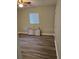 Bedroom showcasing a ceiling fan, natural light, and wood-look flooring at 3118 Adrian Ave, Largo, FL 33774