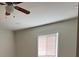 A bedroom features neutral walls and a ceiling fan at 3118 Adrian Ave, Largo, FL 33774