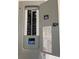 An open gray electrical panel with a printed diagram on the door at 3118 Adrian Ave, Largo, FL 33774