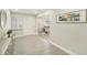 Bright foyer features wood-look tile floors, neutral walls, and an entry door with decorative glass at 3118 Adrian Ave, Largo, FL 33774