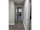 Bright hallway with wood-look flooring leading to additional rooms at 3118 Adrian Ave, Largo, FL 33774
