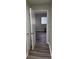 Hallway with wood-look floors and an open doorway to another room at 3118 Adrian Ave, Largo, FL 33774