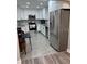 Modern kitchen featuring stainless steel appliances and white cabinets at 3118 Adrian Ave, Largo, FL 33774