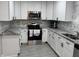 Updated kitchen featuring sleek countertops and stainless steel appliances at 3118 Adrian Ave, Largo, FL 33774