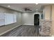 Bright living room featuring a ceiling fan and a decorative fireplace at 3118 Adrian Ave, Largo, FL 33774