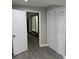 Bedroom with wood look flooring, and double door closet at 3118 Adrian Ave, Largo, FL 33774