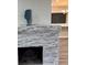 Living room featuring a stone fireplace and an open view to other rooms at 3118 Adrian Ave, Largo, FL 33774