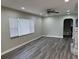 Bright living room featuring a ceiling fan and a decorative fireplace at 3118 Adrian Ave, Largo, FL 33774