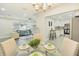 Open floor plan featuring a dining room, living room, and modern kitchen at 3118 Adrian Ave, Largo, FL 33774