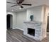 Living room with stylish stone fireplace and modern flooring at 3118 Adrian Ave, Largo, FL 33774