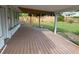Spacious covered back patio with wooden decking, perfect for outdoor entertaining at 3118 Adrian Ave, Largo, FL 33774