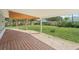 Covered patio overlooks the large backyard, perfect for outdoor entertaining and relaxation at 3118 Adrian Ave, Largo, FL 33774