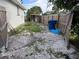 A side yard featuring a wood fence and room for storage or other outdoor activities at 3118 Adrian Ave, Largo, FL 33774