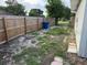 A side yard featuring a wood fence and room for storage or other outdoor activities at 3118 Adrian Ave, Largo, FL 33774