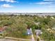 Aerial view of home featuring lush tree coverage and stunning water views at 320 Broadway, Dunedin, FL 34698