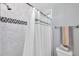 Clean bathroom features a tiled shower-tub combo and modern fixtures at 320 Broadway, Dunedin, FL 34698