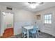 Eat-in dining area with bright white trim and light blue accent chairs at 320 Broadway, Dunedin, FL 34698
