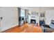 Cozy living room with hardwood floors, fireplace, and natural light at 320 Broadway, Dunedin, FL 34698