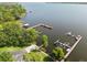 Aerial view featuring boat docks, boat ramp, and lake access for community residents at 3308 Landing Pl, Palm Harbor, FL 34684