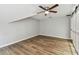 Bedroom featuring hardwood floors, a ceiling fan, natural light, and fresh neutral paint at 3308 Landing Pl, Palm Harbor, FL 34684