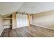 Spacious bedroom with wood floors and closet with sliding shutter doors at 3308 Landing Pl, Palm Harbor, FL 34684