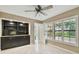 Bedroom with built-in shelving, cabinets, and shuttered windows at 3308 Landing Pl, Palm Harbor, FL 34684