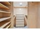 Walk-in closet with ample shelving and built-in drawers for storage at 3308 Landing Pl, Palm Harbor, FL 34684