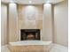 Elegant fireplace featuring light colored tiling and hearth at 3308 Landing Pl, Palm Harbor, FL 34684
