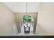 Foyer with decorative chandelier and front door with arched window at 3308 Landing Pl, Palm Harbor, FL 34684